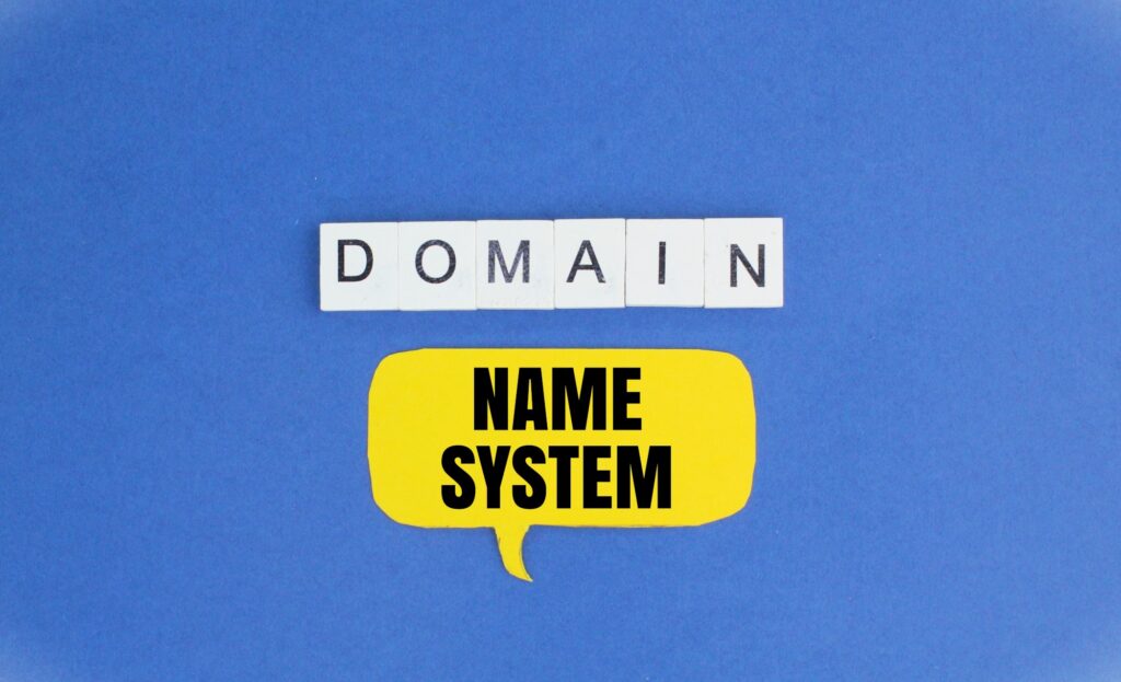 chat box and alphabet letters with the word Domain name system